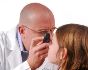optometrist examining eye