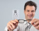 Optometrist holding eye frames